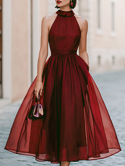 Elegant Sleeveless Halter Midi Dress With Flowing Skirt