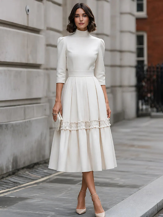 Robe midi plissée à col montant et volants