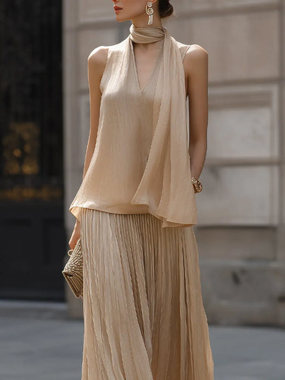 Draped Halter Top And Pleated Maxi Skirt Set With Flowing Silhouette