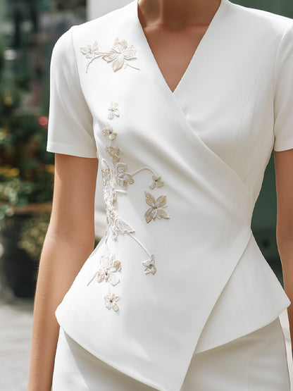 Floral Embroidered Wrap-Front Peplum Blouse