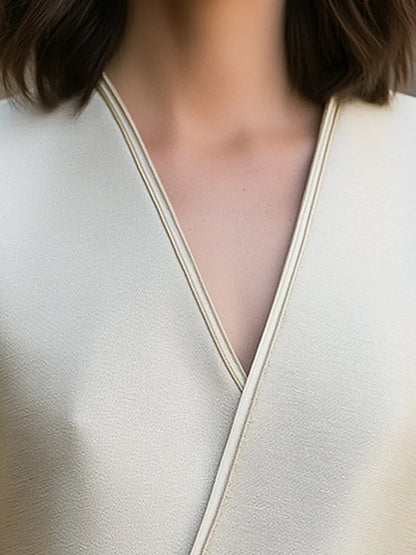Elegant Wrap-Front Short Sleeve Top With Pearl Button Detail