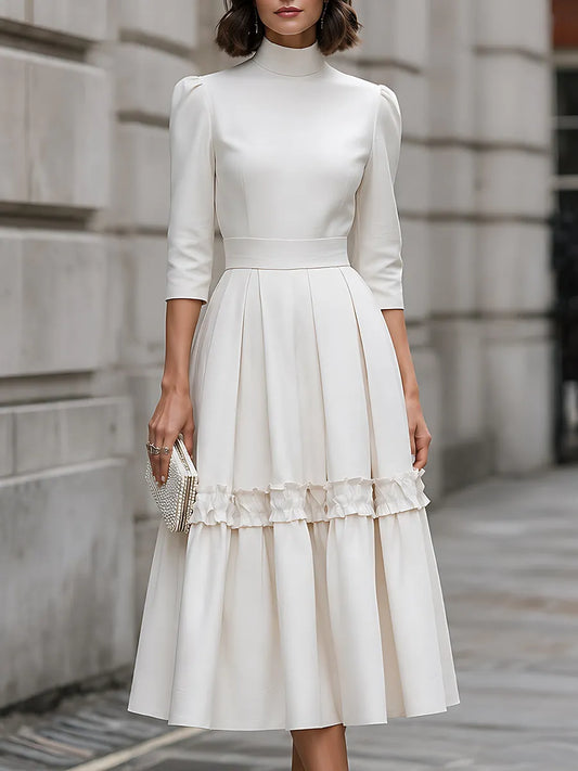 Robe midi plissée à col montant et volants