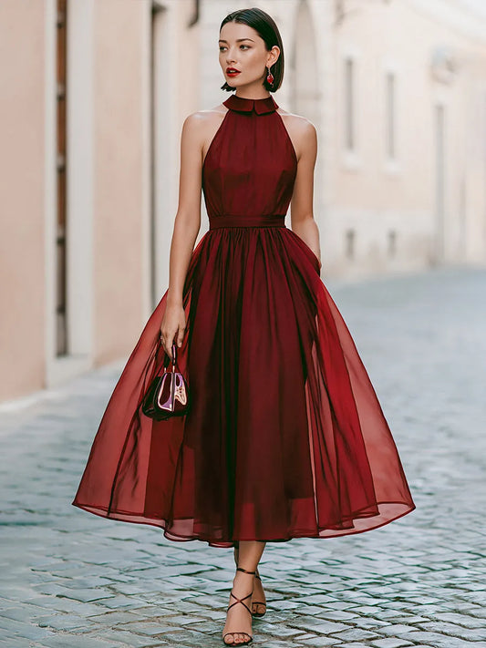 Elegant Sleeveless Halter Midi Dress With Flowing Skirt